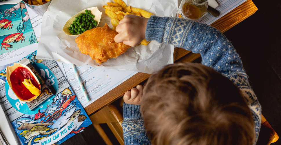 Child eating at Rockfish